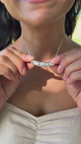 A woman wearing a Hawaiian Heirloom Pendant in Sterling Silver - 7mm-Maui Divers Jewelry