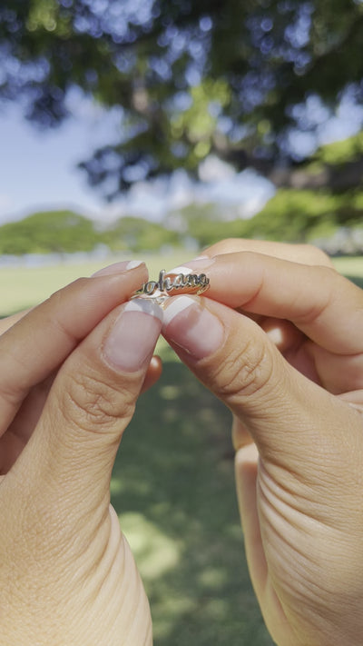 video of a woman's hand wearing a Ohana Ring in Gold - 5mm - Maui Divers Jewelry