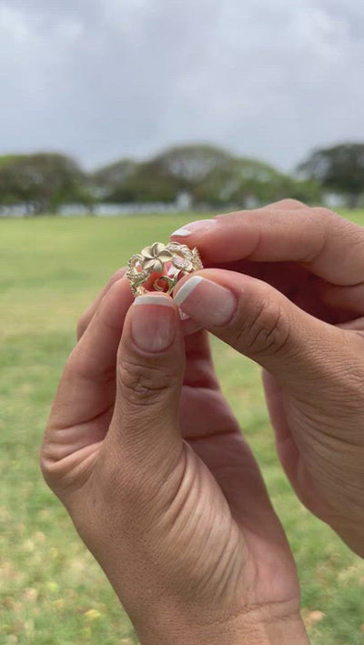 Video of a woman's hand with a Hawaiian Heirloom Plumeria Ring in Gold with Diamonds - 8mm - Maui Divers Jewelry