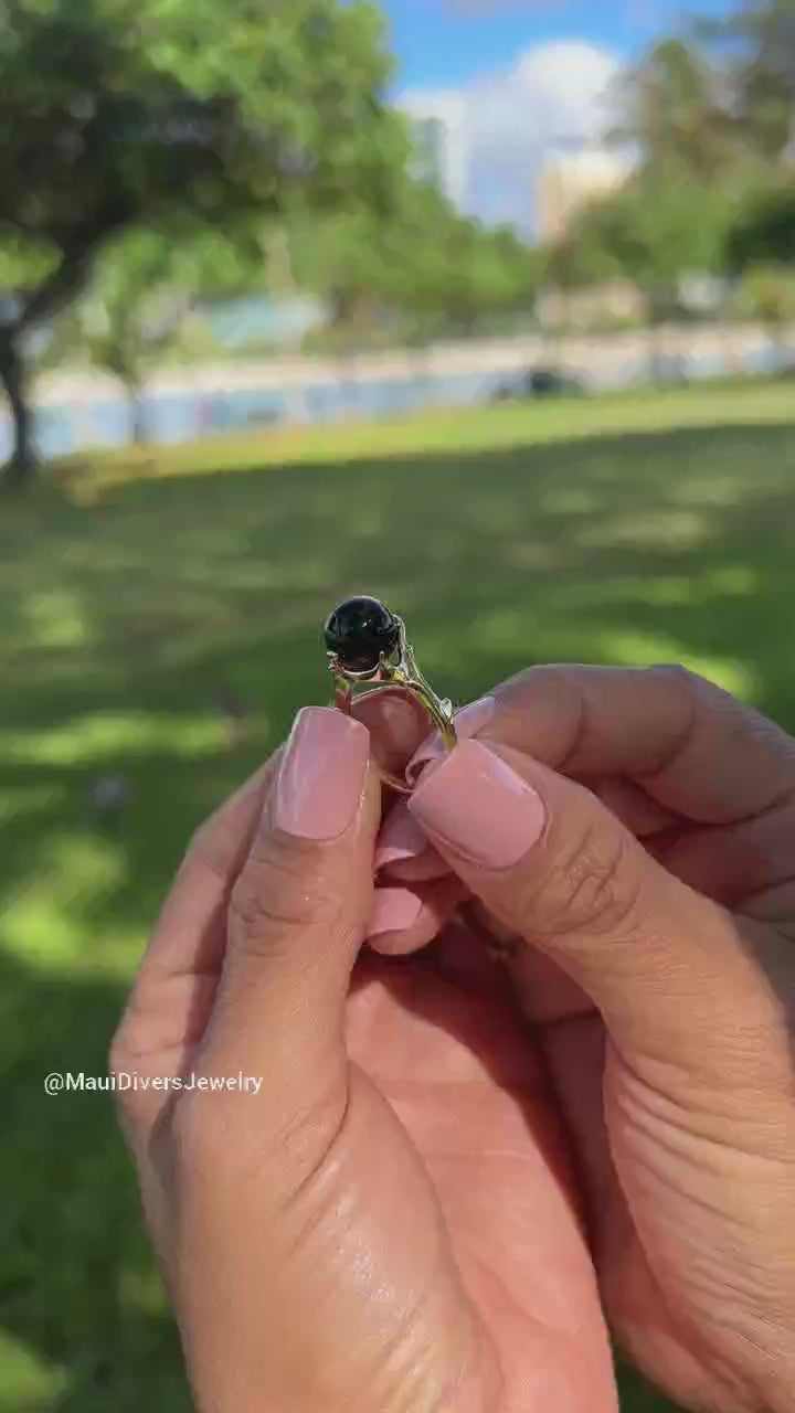Video of a woman's hand wearing a Hawaiian Heritage Black Coral Ring in Gold - Maui Divers Jewelry