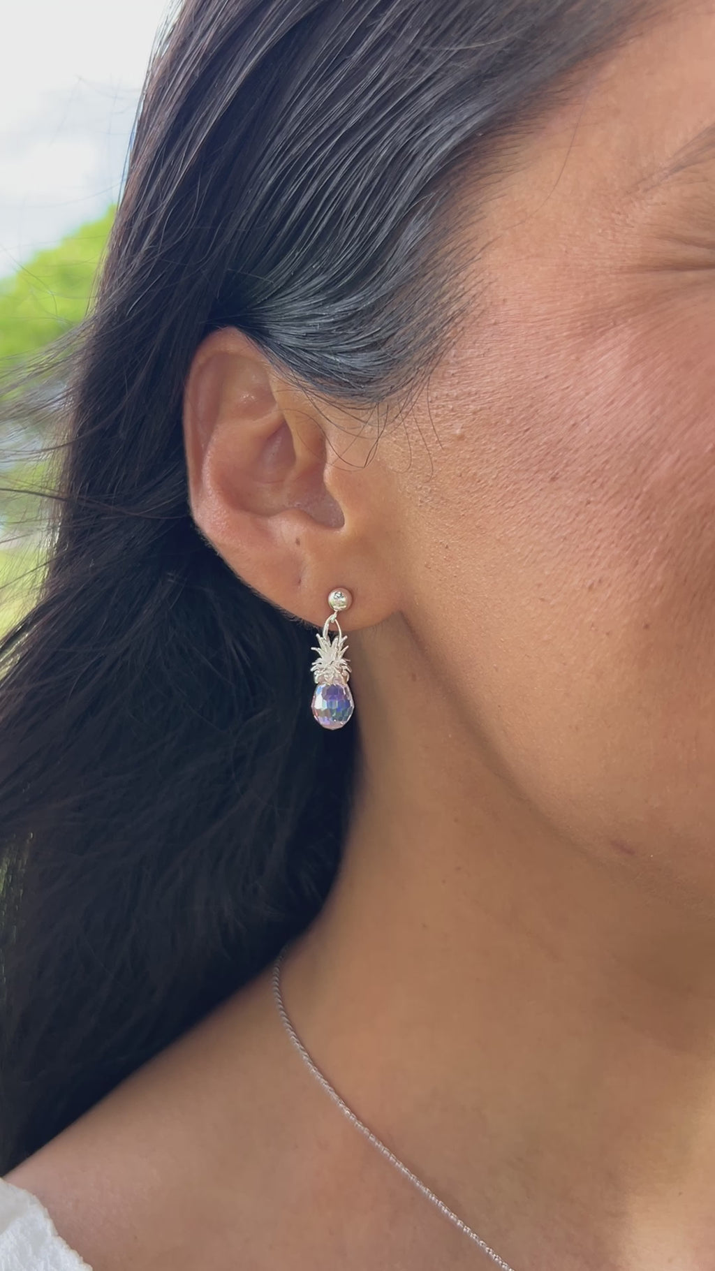 Video of a woman's ear with Crystal Pineapple Dangle Earrings in Sterling Silver - Maui Divers Jewelry