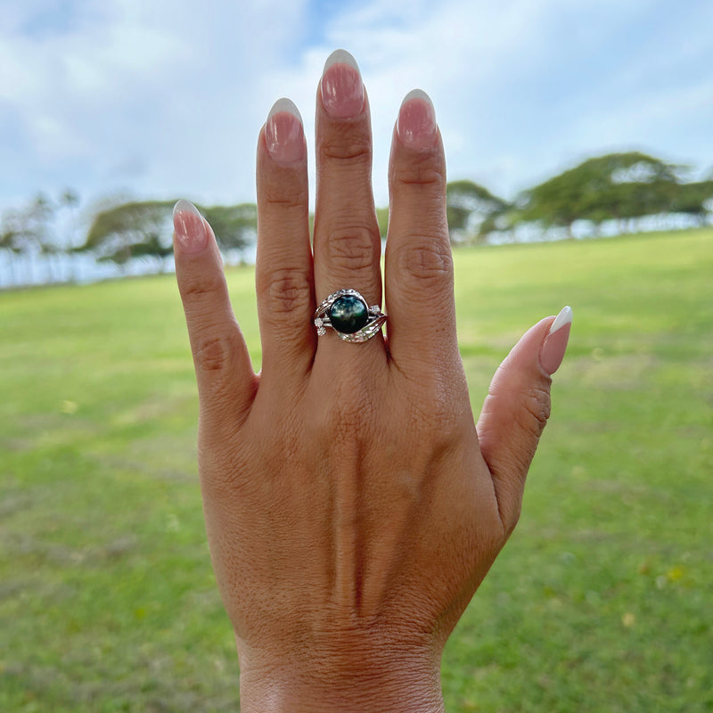 A woman's hand with a Tahitian Black Pearl Ring with Diamonds in 14K White Gold (9-10mm)-Maui Divers Jewelry