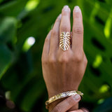 A woman's hand with a Monstera Ring in Gold on it - Maui Divers Jewelry
