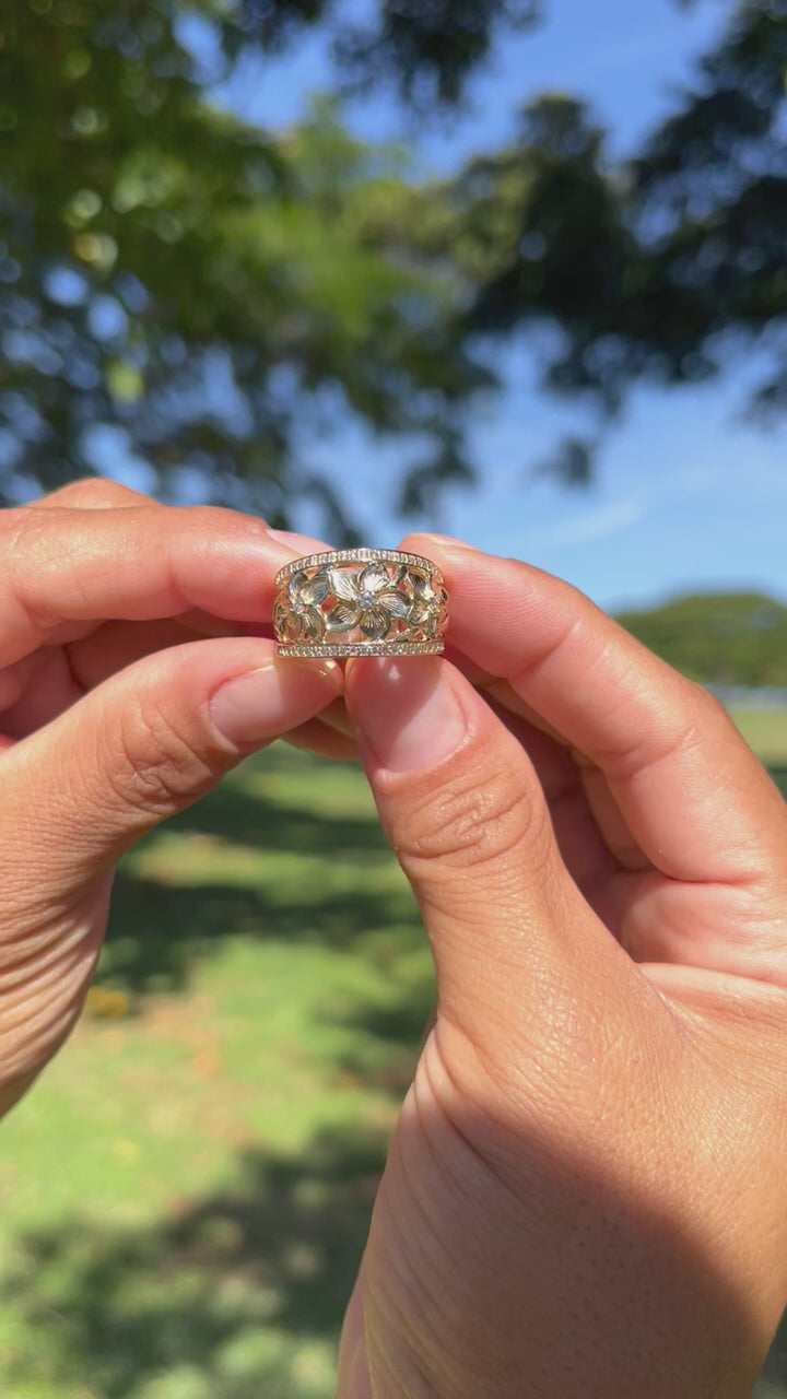 Video of a woman's hand wearing a Hawaiian Heirloom Plumeria Ring in Gold with Diamonds - Maui Divers Jewelry