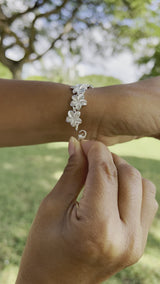 Video of a woman's wrist wearing a Plumeria Bracelet in Sterling Silver - 13mm-Maui Divers Jewelry