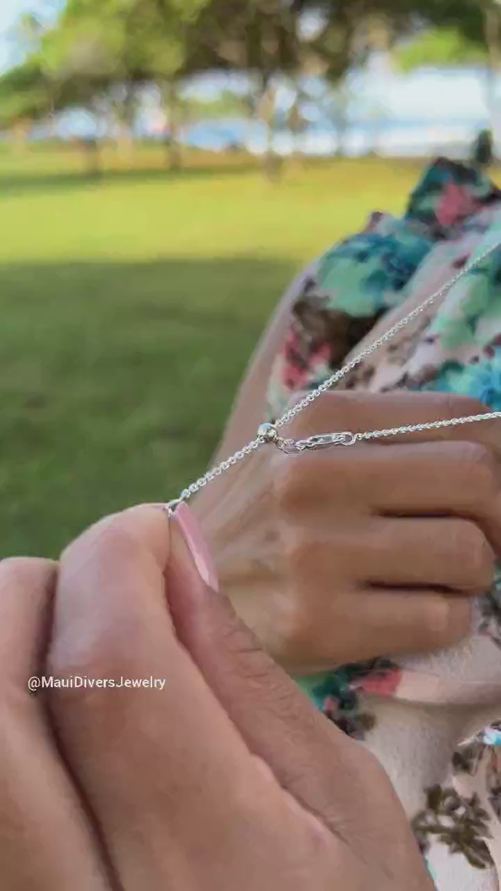 Video of a woman wearing a 24" Adjustable Nalu Necklace in Sterling Silver - 24mm - Maui Divers Jewelry