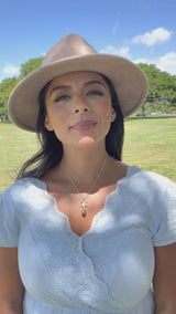 Video of woman wearing an Ocean Dance Honu (Sea Turtle) Tahitian Black Pearl Pendant in Gold with Diamonds - 9-10mm - Maui Divers Jewelry