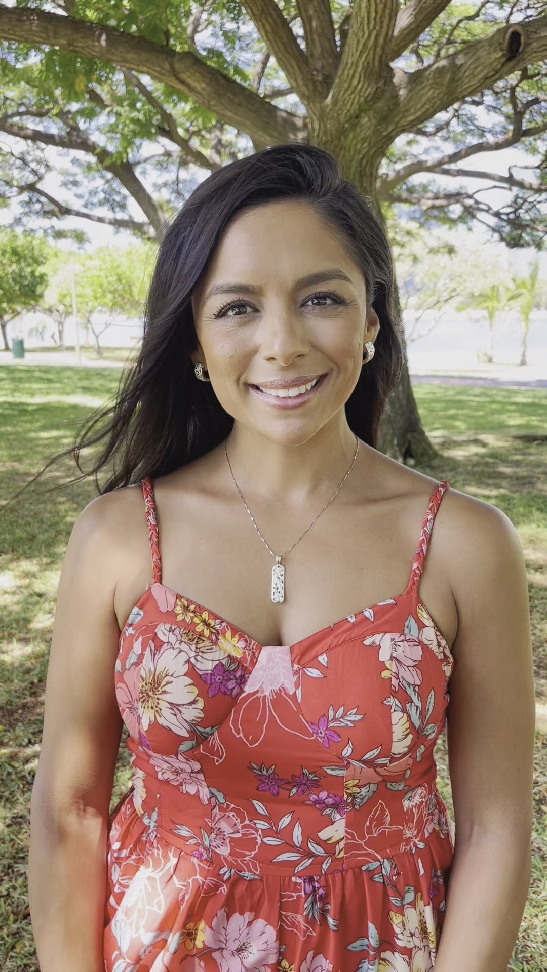 Video of a woman wearing a Hawaiian Heirloom Plumeria Scroll Hoop Earrings in Sterling Silver - 8mm - Maui Divers Jewelry