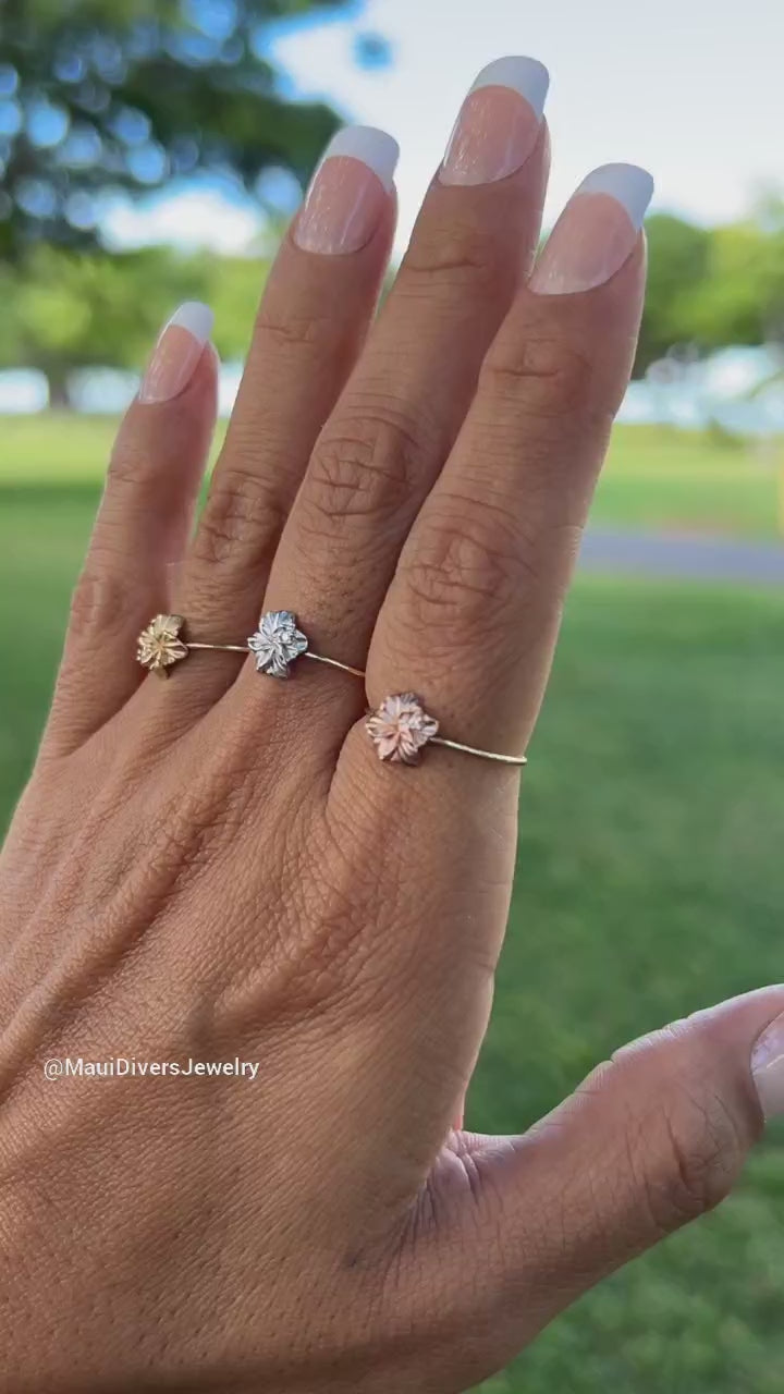 Video product of a woman's hand wearing a Hawaiian Gardens Hibiscus Ring in Gold with Diamonds - 8mm - Maui Divers Jewelry