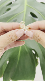 Video product of a woman's hand wearing a Nalu Ring in Gold - Maui Divers Jewelry