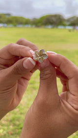 Video of a woman's hand wearing a Plumeria Mother of Pearl Ring in Gold - Maui Divers Jewelry