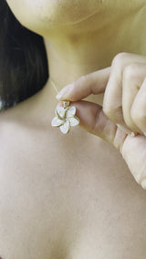 Video of a woman wearing a Plumeria Mother of Pearl Pendant in Gold - 18mm-Maui Divers Jewelry