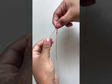 Video of a woman showing how to adjust the length of a 0.7mm Box Chain in Rose Gold - Maui Divers Jewelry
