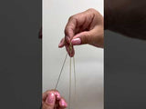Video of a woman showing how to adjust a Raso Chian in Gold - Maui Divers Jewelry