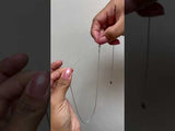Video of a woman showing how to adjust a 16-22" 1mm Rope Chain in White Gold - Maui Divers Jewelry