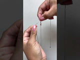 Video of a woman showing how to adjust the chain length - Maui Divers Jewelry